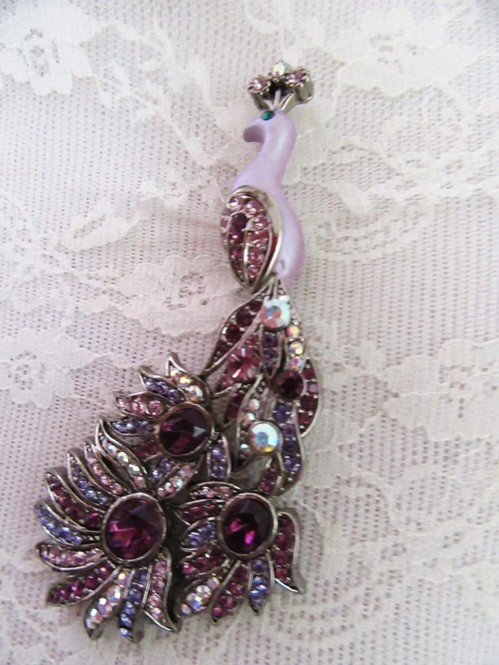 Peacock brooch with purple and aurora borealis rhinestones in silver setting
